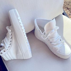 White, high top, canvas tennis shoes